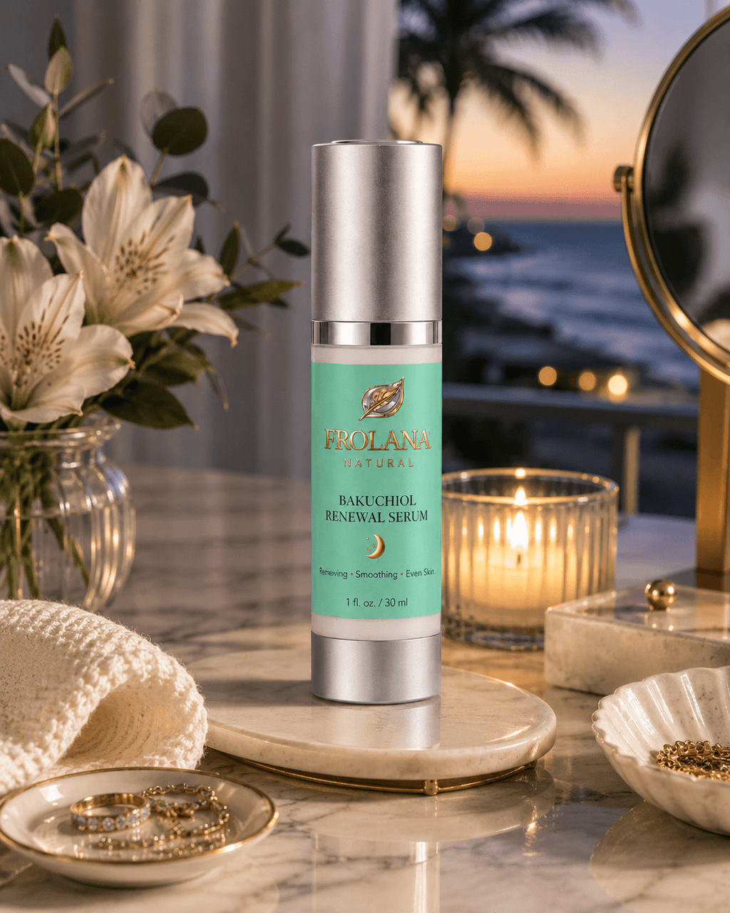 A premium bottle of Frolana Natural Bakuchiol Renewal Serum displayed on a textured stone vanity tray. The white airless bottle features a soft teal label and sits alongside a glowing candle, fresh white lilies, and jewelry, set against a serene sunset over a tropical ocean beach.