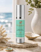 Frolana Natural Bakuchiol Renewal Serum for mature skin, displayed on a stone slab in a coastal setting with decorative coral.