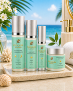 Four Frolana Natural skincare products from the Daytime Architect "Morning Ritual" set arranged elegantly on a textured beige tray. The premium collection features frosted glass and aqua-tinted bottles with champagne metallic pumps, including Soft Renewal Cleansing Milk, Wild Plum Radiance Toner, Peptide Lift Serum, and Timeless Hydration Day Cream, set against a bright, tropical beach background with soft sand and palm leaves.