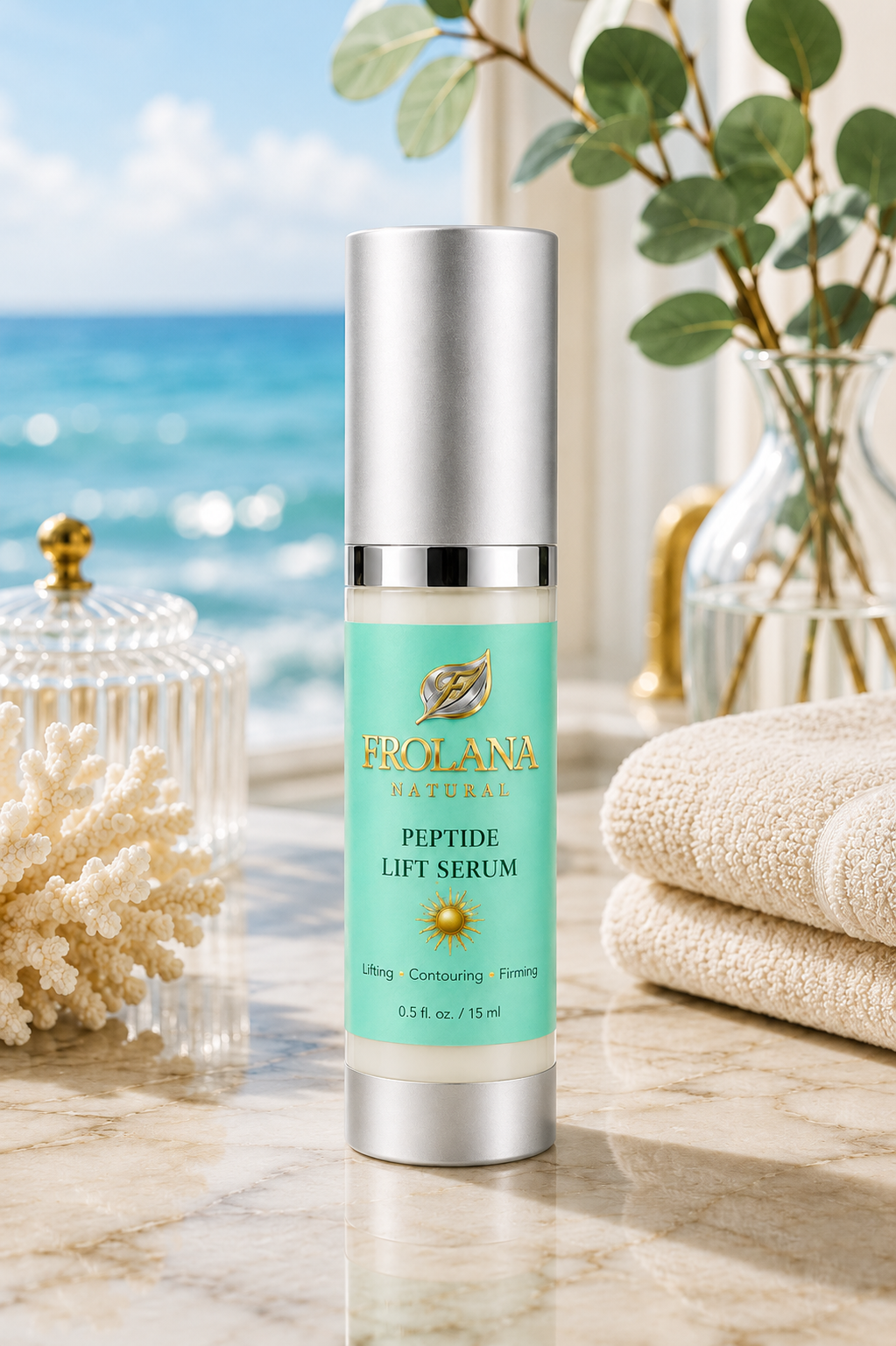 Frolana Natural Peptide Lift Serum on a coastal vanity with ocean view, towels, and eucalyptus