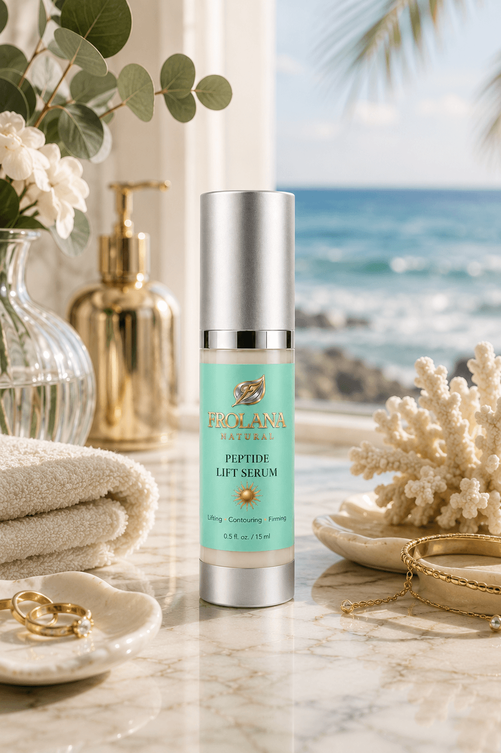 Frolana Natural Peptide Lift Serum for mature skin, displayed on a marble vanity in a coastal setting with gold jewelry, coral, and an ocean view.