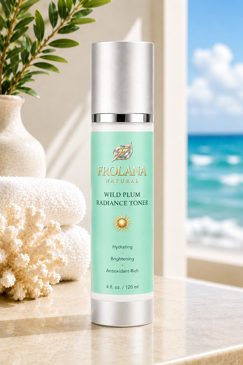 Frolana Natural Wild Plum Radiance Toner with Pearl Aqua label on a coastal stone ledge