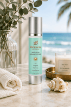 Frolana Natural Wild Plum Radiance Toner for mature skin, displayed on a marble surface in a coastal setting with eucalyptus, a seashell, and an ocean view.